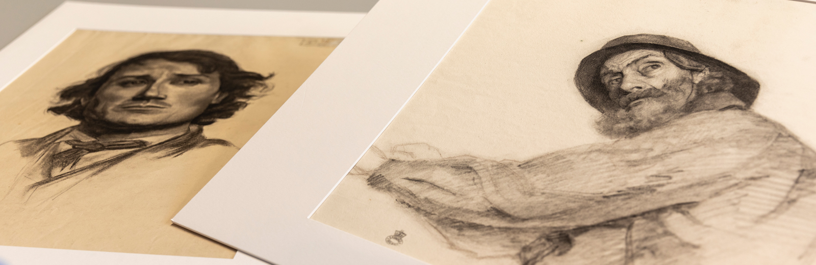 Two drawings by Minnie Jane Hardman. On the right is a fisherman and on the left is the head of a younger male figure.