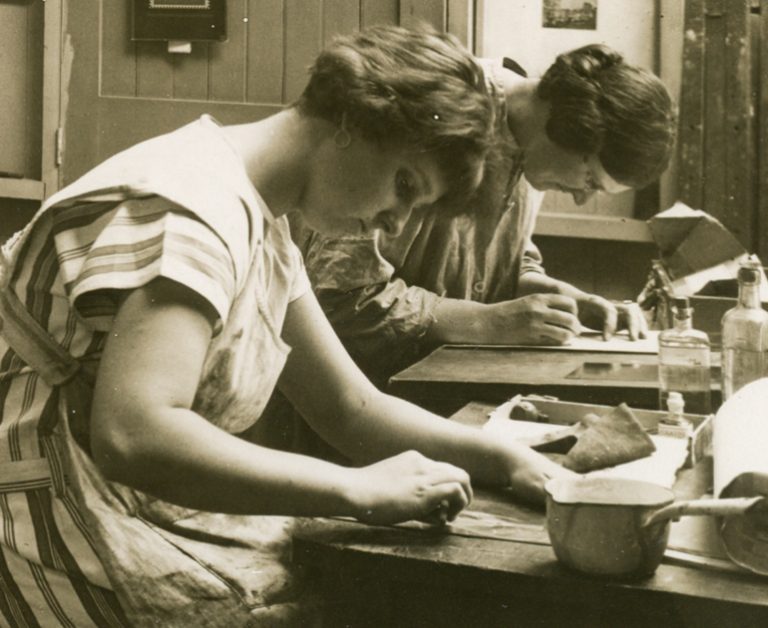 Closeup of two women at Reading School of Art in an etching class.