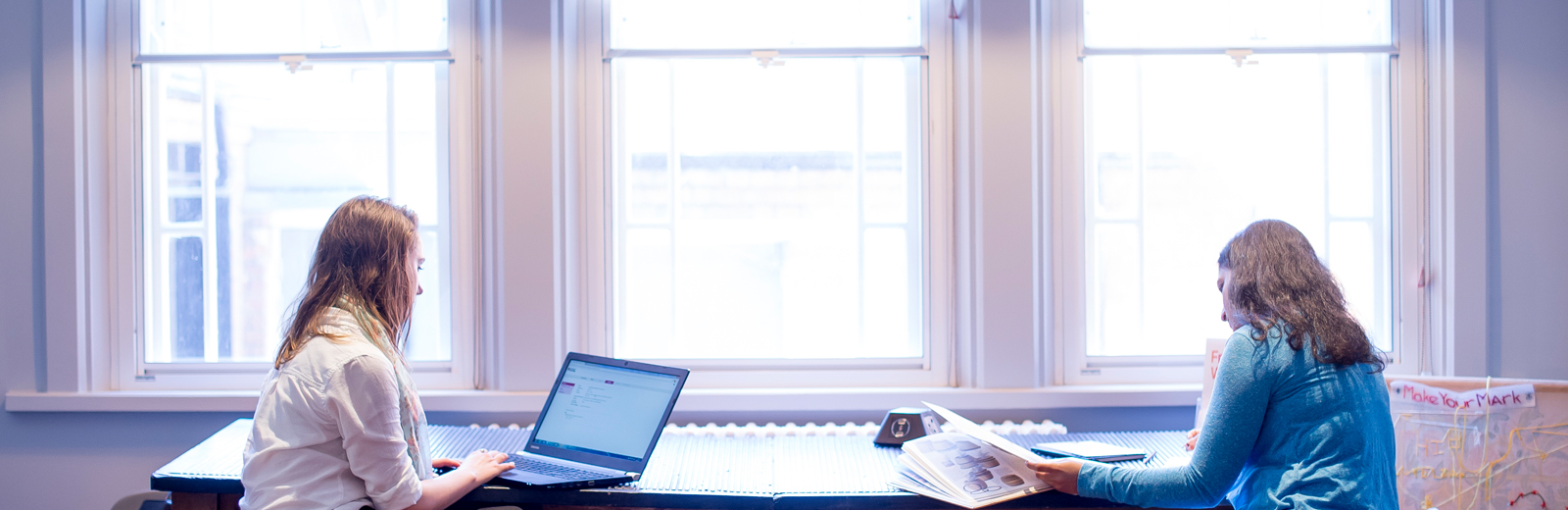 Two students studying in the Nook