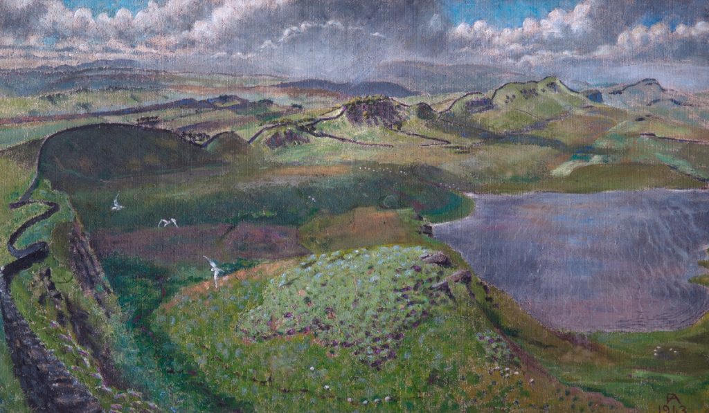 View down onto Hadrian's Wall and surrounding countryside, with lake at the right.