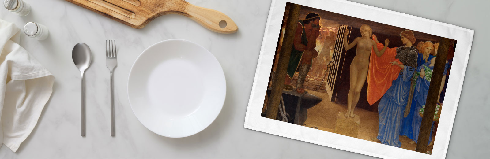 Table with tea towel featuring artwork of 'Pandora' from the Art Collection.