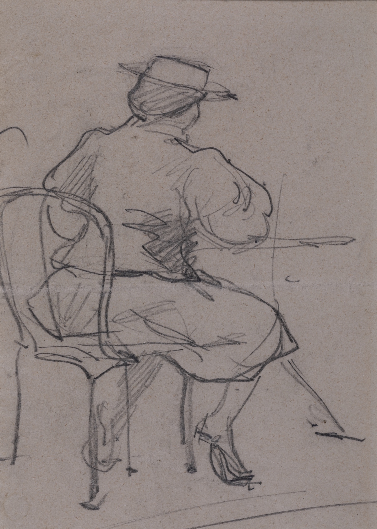 Woman sitting at a table, wearing a hat and visible from behind