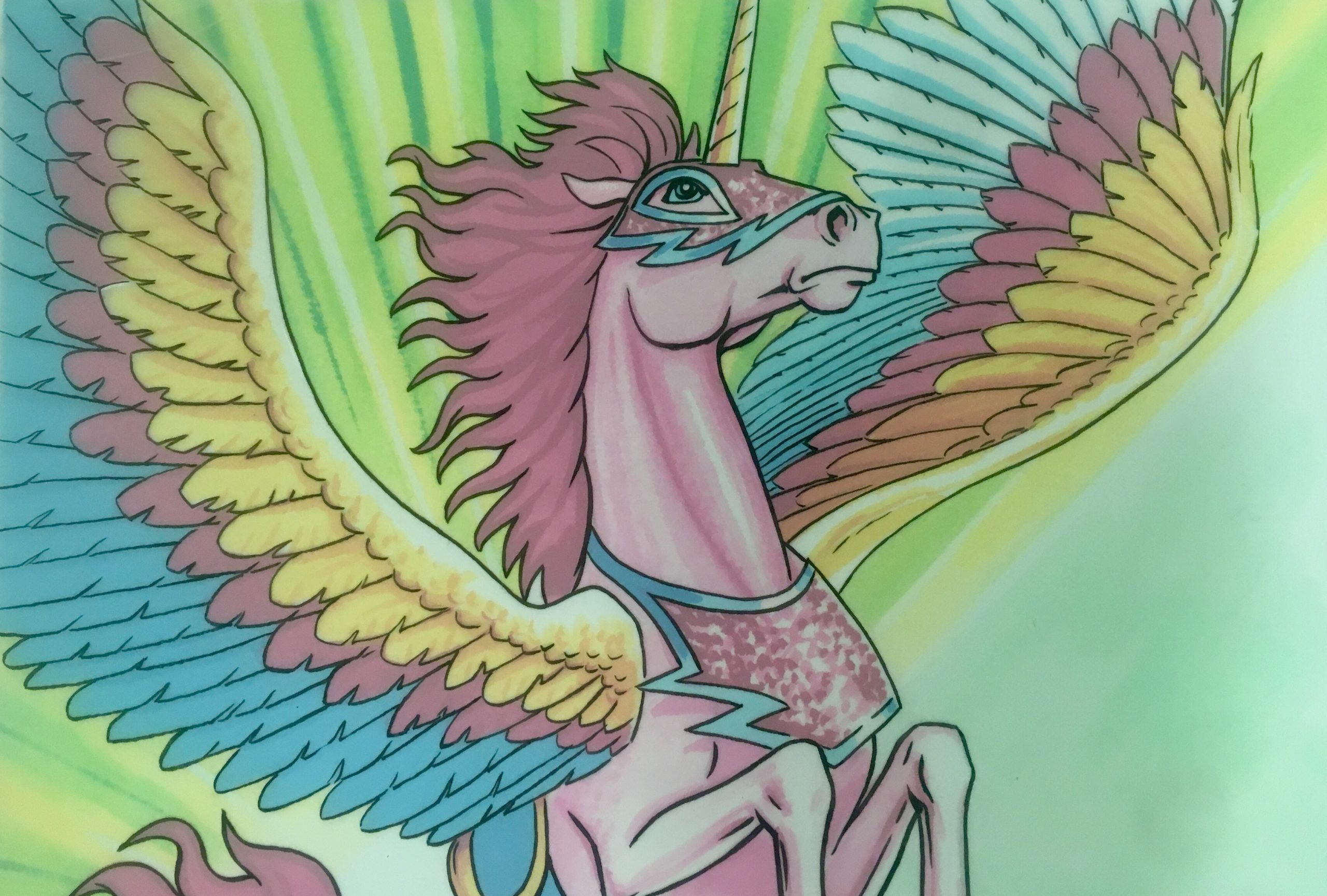 Head and shoulders of rearing pink horse with mulit-coloured outstretched wings and a horn. The horse is wearing a pink breastplate with blue edges and a pink mask with blue edges