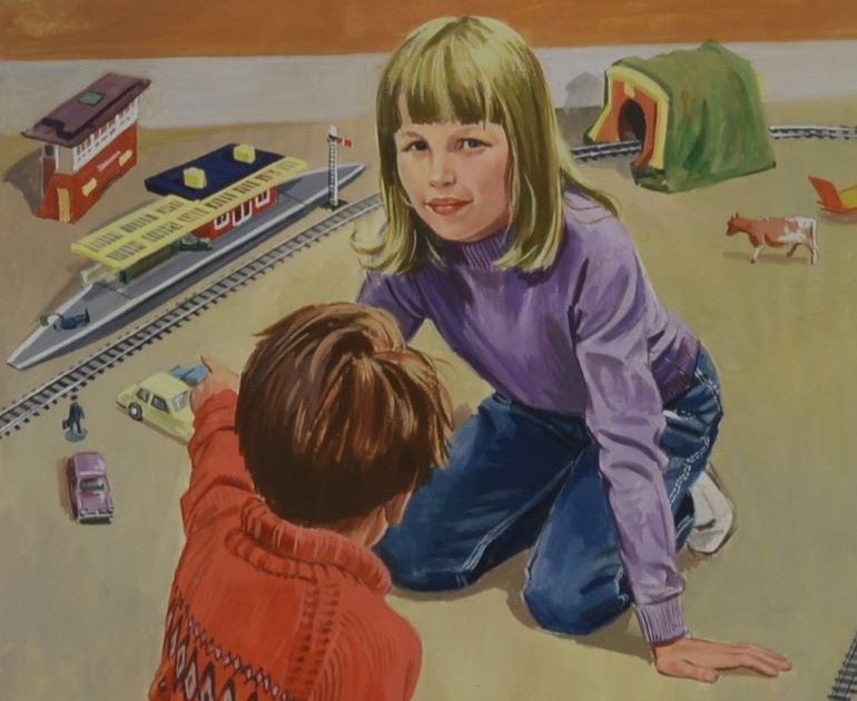 Closeup of a blonde girl kneeling on the floor surrounded by toys. In front of her is the upper half of a brown-haired boy with his left arm raised.