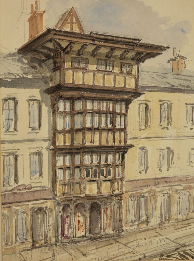 An architectural drawing made with pencil and watercolour washes. It depicts a historic building façade with a prominent projecting timber-framed bay that extends multiple stories upward. The structure features dark wooden beams arranged in a grid pattern, with many small windowpanes set between them. The overhanging upper stories suggest traditional timber-framed construction.