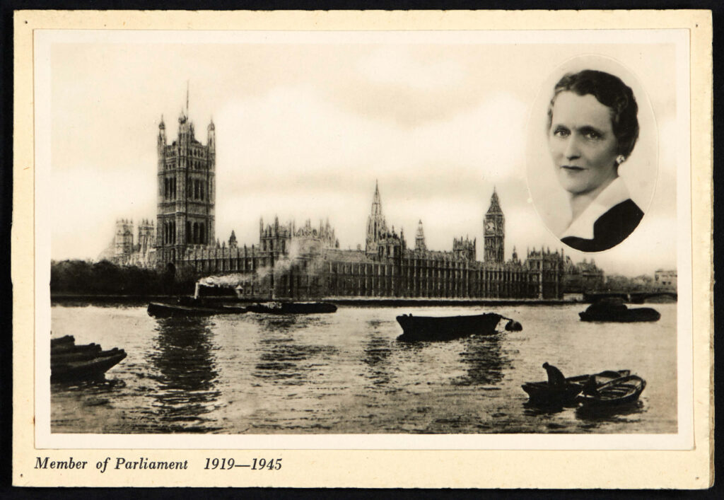 A black and white postcard showing the Houses of Parliament with an image of Nancy Astor superimposed and bearing the dates of her tenure as an MP.