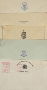 A pile of envelopes from the late 1950s showing pictorial post marks from different academic institutions
