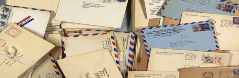 A pile of letters from the late 1950s showing colourful designs and stamps