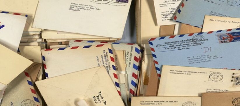 A pile of letters from the late 1950s showing colourful designs and stamps