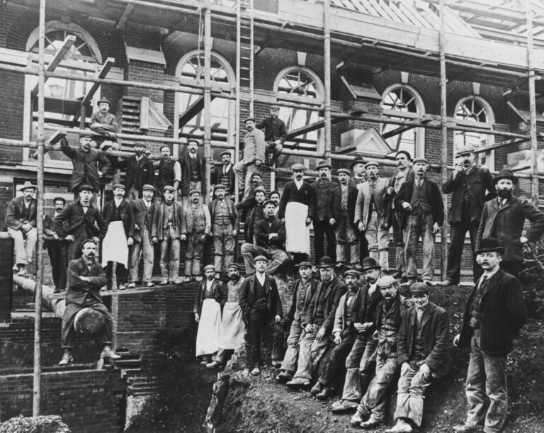 Builders working on a partially-complete c 1906. Great Hall