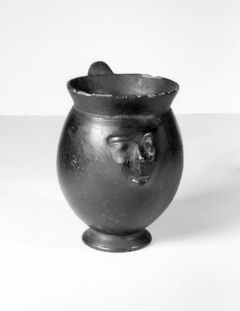 3	Early 6th-century BC bucchero face mug