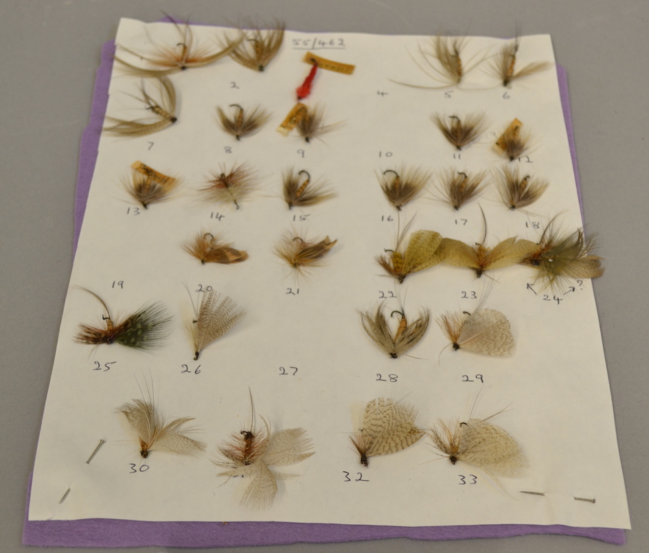 This set of fishing flies originally came in a round tin, which is now missing. They are mostly flies of the May Fly variety, but there is also one unidentified damaged fly, one Spent Wing May Fly, and one large hook size 1 1/2.