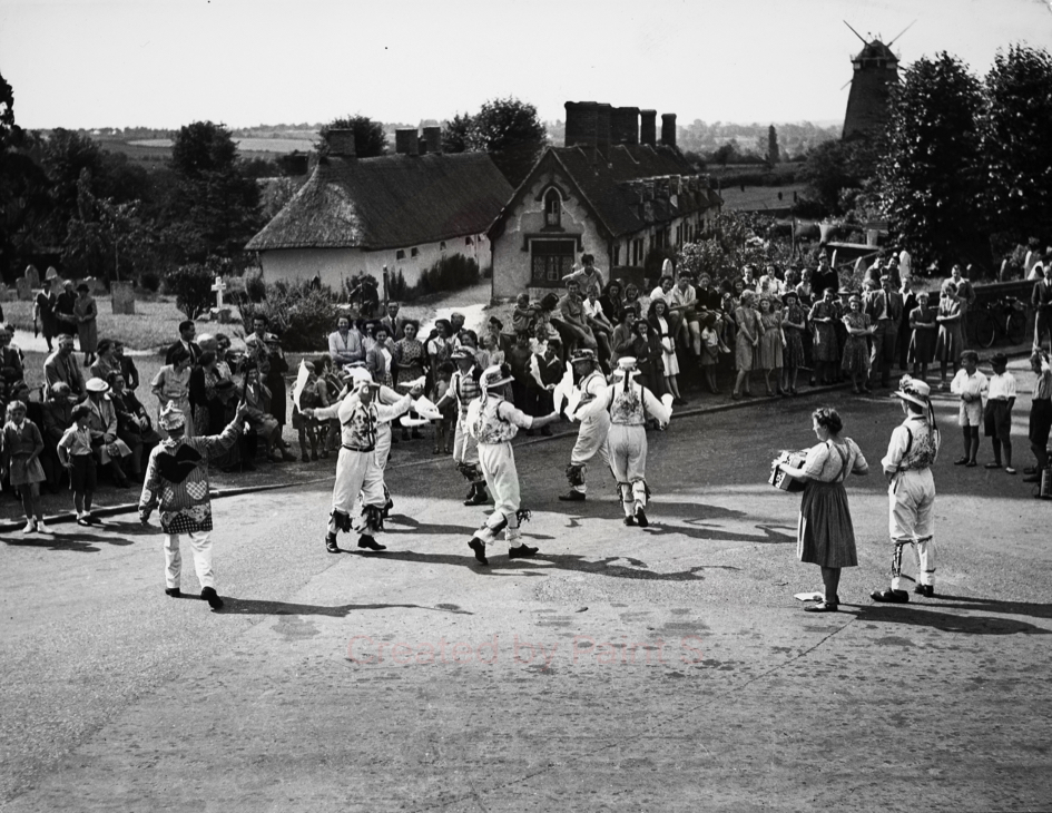 Black and white photograph of Morris dancers at Thaxted, Essex