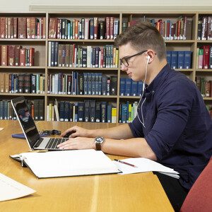 Student researching in The Reading Room of University of Reading Special Collections